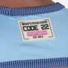 Primer plano de la etiqueta Code 22 en el arnés Reflex Top Azul.