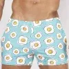 bañador corto Sweet Banana Eggs azul turquesa con estampado de huevos vista frontal