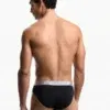 Slip hombre negro Emporio Armani, cinturilla monogram gris, vista trasera.