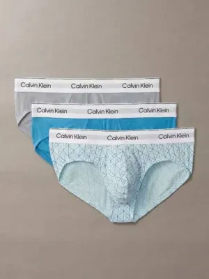 Pack de 3 calzoncillos tipo slip Calvin Klein Icon Cotton Stretch en azul cian, gris neblina y blanco estampado.