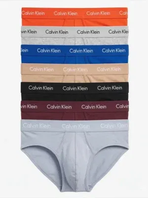 Pack de 7 slips Calvin Klein Cotton Stretch multicolor apilados, mostrando la paleta completa para rotación semanal.