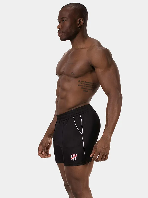 Vista lateral del short deportivo negro Luka de Barcode Berlin con ribete blanco