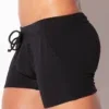 Vista lateral close-up bañador boxer negro Code 22 New York mostrando perfil de cintura y corte