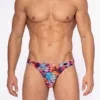 Vista frontal de tanga Olaf Benz RED2559 Pink Flower con estampado floral en magenta, naranja y turquesa