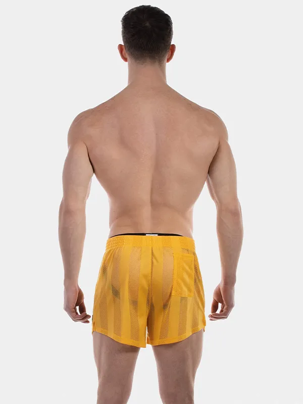 Vista trasera del short de rejilla amarillo Mikkel de Barcode Berlin
