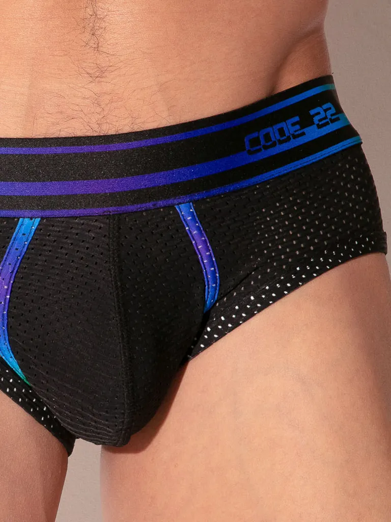 Detalle de tejido mesh negro con cinta Pride en cinturilla. Slip Code 22 Pride Negro.